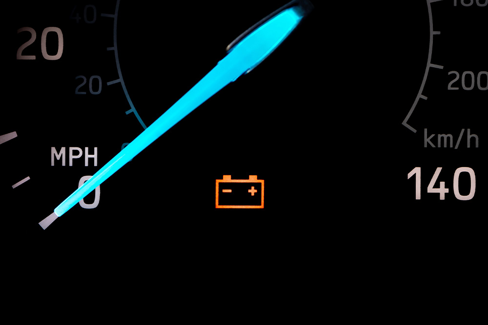 Maintenance in Preserving Battery Health in Capitol Heights, MD at Bavarian Motor Repairs. Image of Car battery warning light illuminated on the dashboard, representing the importance of maintenance in preserving battery health.