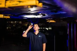 Guy Inspecting Chasis
